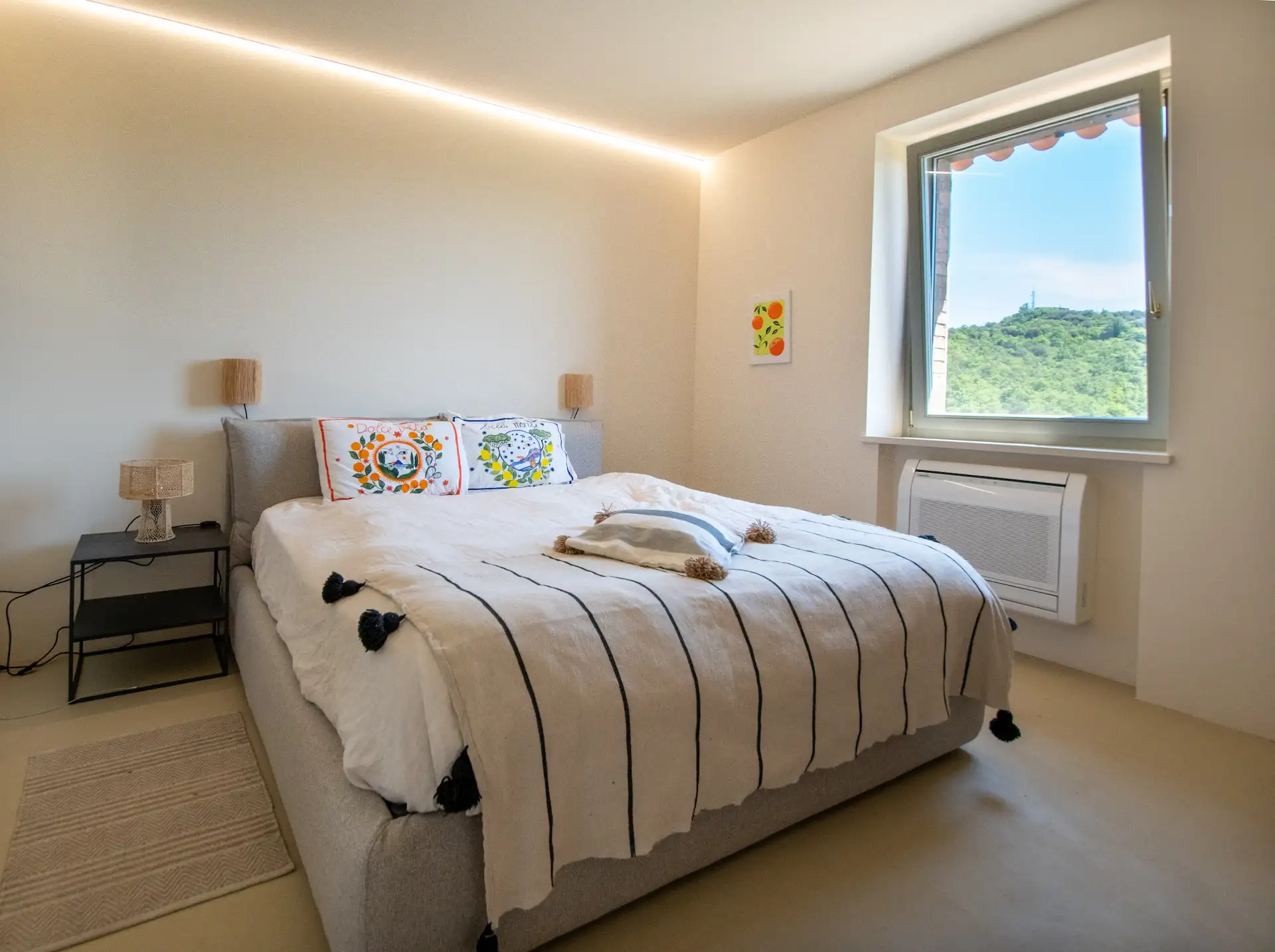 View of the spacious main bedroom at Villa Lidia
